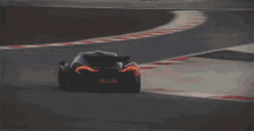 Black Sports Car on Curvy Track