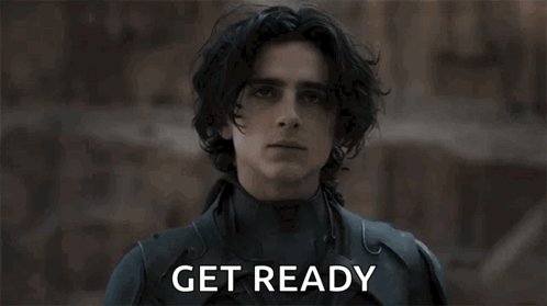 Black Suited Man Holding Knife Saying Get Ready