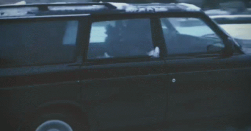 Black SUV Driving Through Snow