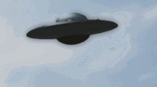Black UFO Flying Through Blue Sky