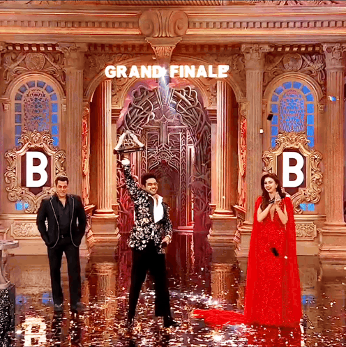 Black White Suit Man Holds Trophy Grand Finale GIF