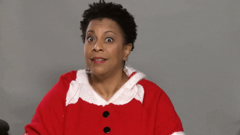 Black Woman Santa Flipping Hood GIF