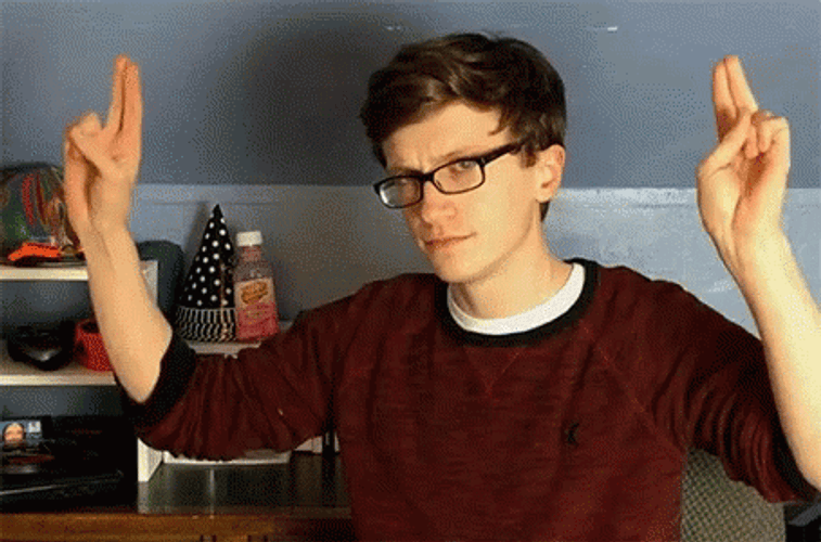 Blank Face Air Quotes GIF