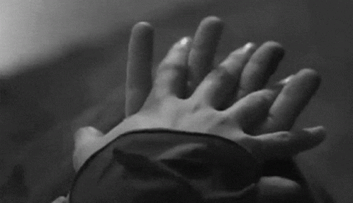 Blindfolded Person Holding Another's Hand GIF