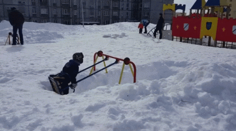 Blizzard Aftermath  Kid Playing In Swing  GIF