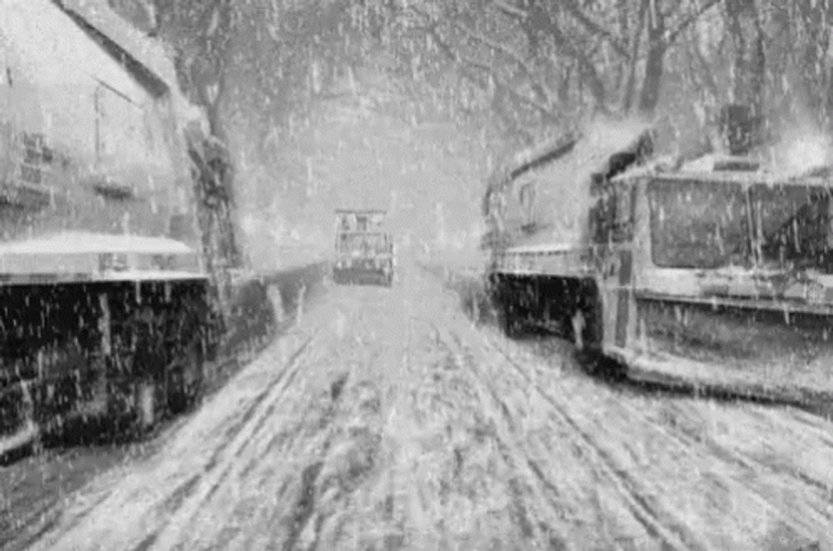 Blizzard Heavy Trucks Travelling Icy Road GIF