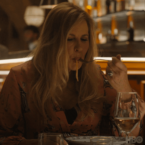 Blond Woman Eating Noodles GIF