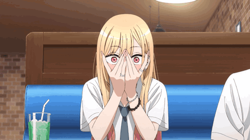 Blonde Anime Girl Covering Face in Diner