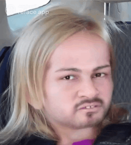 Blonde Bearded Man Making Funny Face on Airplane