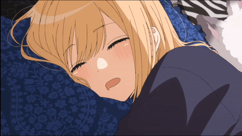 Blonde Girl Laying On Blue Pillow With Eyes Closed GIF