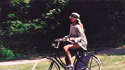 Blonde Girl Smiling Riding Bike GIF