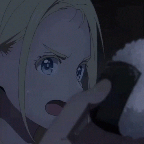 Blonde Girl With Blue Eyes Holding Rice Ball