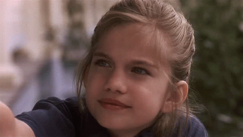 Blonde Girl With Blue Eyes Looking Up GIF