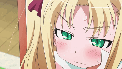 Blonde Girl With Green Eyes Making a Face