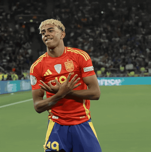Blonde Hair Man in Red Yellow Adidas Jersey