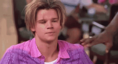 Blonde-Haired Man in Pink and Purple Shirts