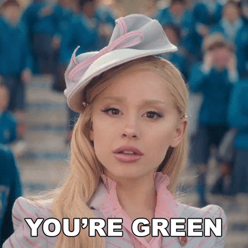 Blonde in Pink Dress and White Hat Saying You're Green