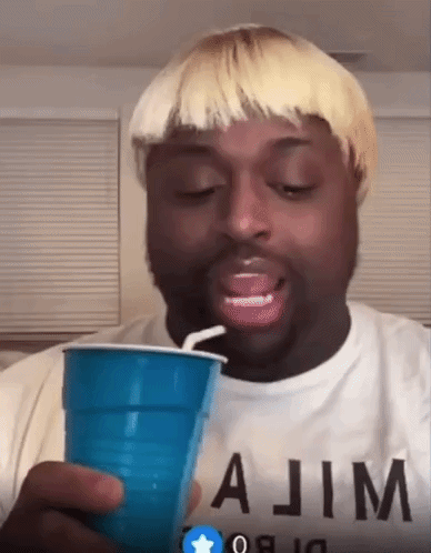 Blonde Man Drinking From Blue Plastic Cup With Straw