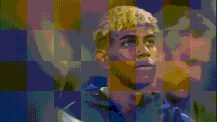 Blonde Man Next to Man in Blue Shirt
