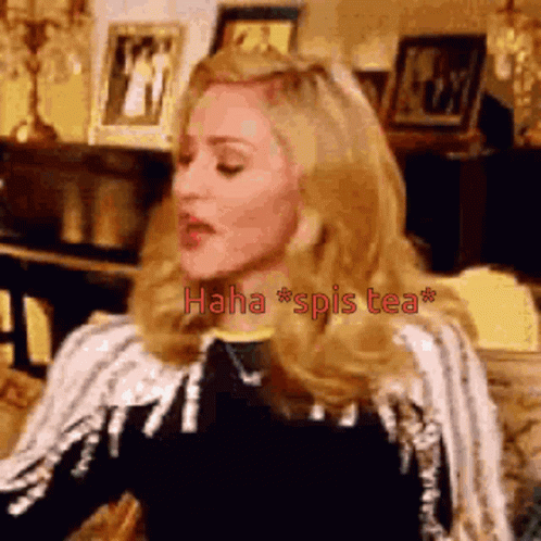 Blonde Woman at Table Saying Haha Spis Tea