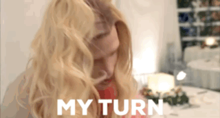 Blonde Woman at Table Saying My Turn