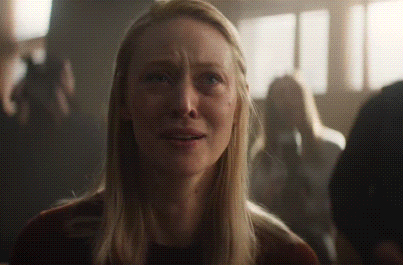Blonde Woman Crying in Dark Crowd
