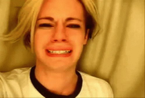 Blonde Woman Crying In White Shirt And Black Collar GIF