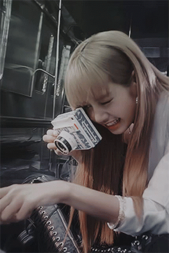 Blonde Woman Holding Polaroid Camera Smiling