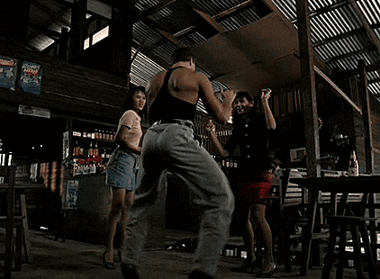 Blonde Woman In Black Bra And Necklace Looking Away GIF