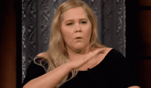 Blonde Woman in Black Shirt Making Funny Face