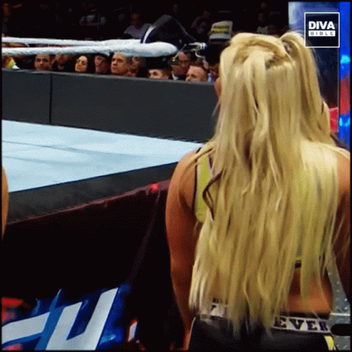 Blonde Woman in Front of Diva Direct Sign