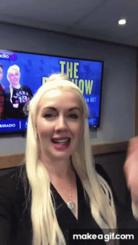 Blonde Woman In Front Of TV Saying The Show GIF