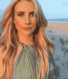 Blonde Woman In Green Dress On Beach GIF