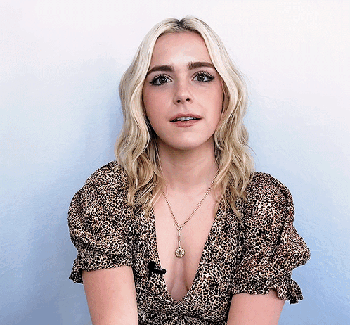 Blonde Woman in Leopard Top With Coin Necklace