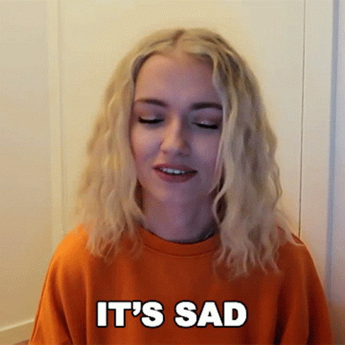 Blonde Woman In Orange Sweatshirt Saying Sad GIF