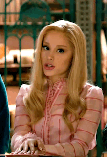 Blonde Woman In Pink Striped Shirt Sitting At Table GIF