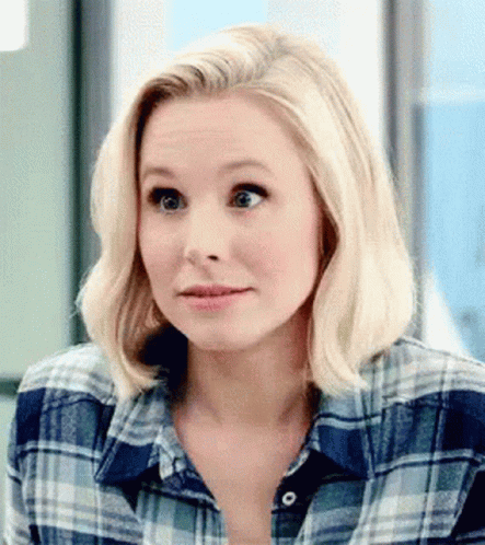 Blonde Woman in Plaid Shirt Making Funny Face