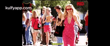 Blonde Woman In Polka Dot Shirt And Black Jacket GIF