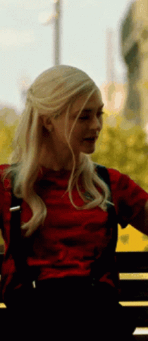 Blonde Woman in Red Shirt Sitting on Bench