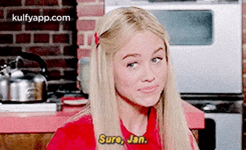 Blonde Woman in Red Shirt Talking to Man