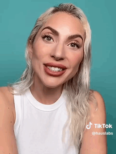 Blonde Woman in White Tank Top Smiling