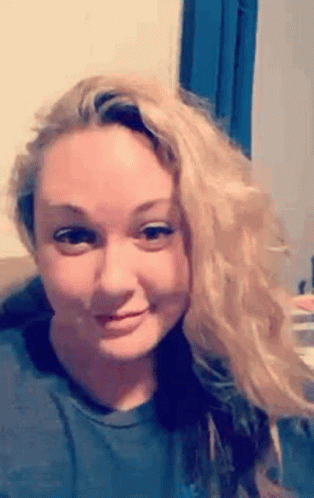 Blonde Woman Making Funny Face on Couch