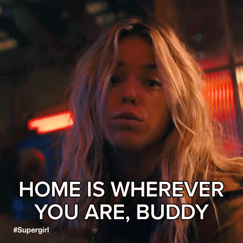 Blonde Woman Saying Home Is Wherever You Are Buddy