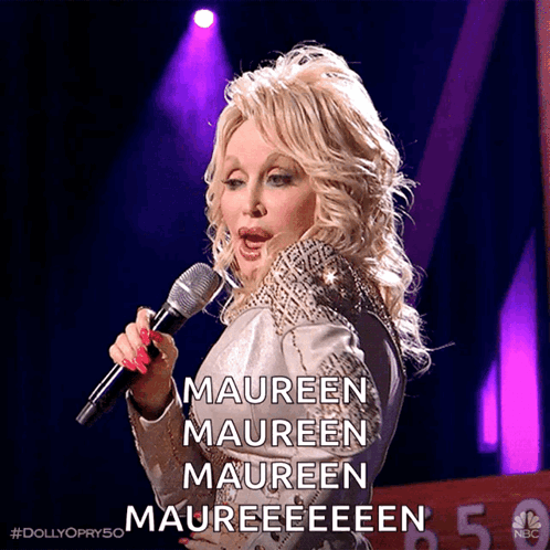 Blonde Woman Singing Maureen Maureen Maureen Into Microphone