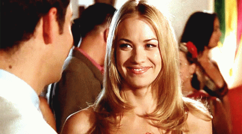 Blonde Woman Smiling at Man