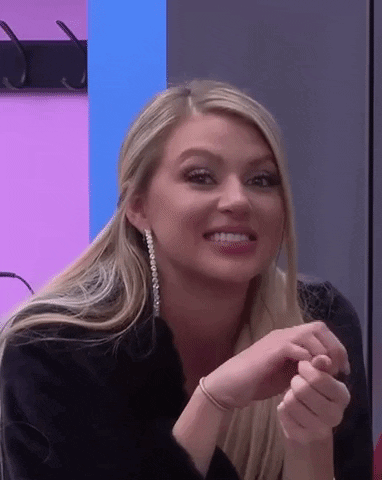Blonde Woman Smiling in Black Jacket