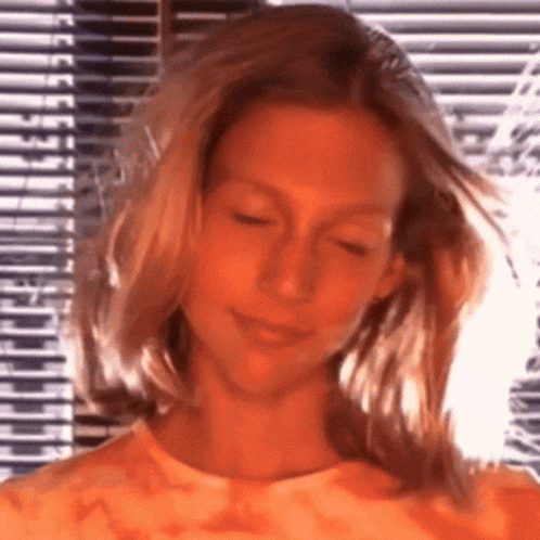 Blonde Woman Standing by Window