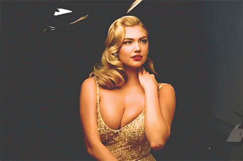 Blonde Woman Standing in Front of Black Background