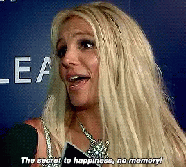Blonde Woman Talking Into Microphone The Secret To Happiness No Memory