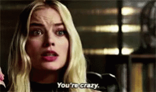 Blonde Woman Talking on Phone Saying You're Crazy